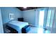 A well-lit bedroom features laminate floors, natural light, and ample storage space for comfortable living at 200 Maitland Ave # 232, Altamonte Springs, FL 32701