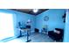 Cozy bedroom with blue walls, laminate flooring, ceiling fan, and natural light from the window at 200 Maitland Ave # 232, Altamonte Springs, FL 32701