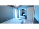 Spacious bedroom with mirror closet doors, laminate floors, and ensuite bathroom at 200 Maitland Ave # 232, Altamonte Springs, FL 32701
