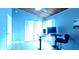 Bedroom with built-in closet, desk, and laminate floors, providing ample space for a work-from-home setup at 200 Maitland Ave # 232, Altamonte Springs, FL 32701