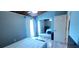 Spacious bedroom with mirror closet doors, laminate floors, and ensuite bathroom at 200 Maitland Ave # 232, Altamonte Springs, FL 32701