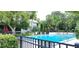 Beautiful community pool with ample seating and well-manicured landscaping at 200 Maitland Ave # 232, Altamonte Springs, FL 32701