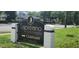 Capistrano Condominiums clubhouse signage in landscaped entrance area at 200 Maitland Ave # 232, Altamonte Springs, FL 32701