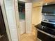 Convenient laundry area with washer and dryer tucked away in a closet, next to the kitchen at 200 Maitland Ave # 232, Altamonte Springs, FL 32701