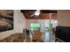 Living room featuring a vaulted ceiling with views into the dining area at 200 Maitland Ave # 232, Altamonte Springs, FL 32701