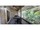 Relaxing screened patio features tropical landscaping and patio furniture at 200 Maitland Ave # 232, Altamonte Springs, FL 32701