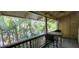 Relaxing screened patio features tropical landscaping and patio furniture at 200 Maitland Ave # 232, Altamonte Springs, FL 32701