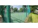 View of community tennis court surrounded by chain link fence at 200 Maitland Ave # 232, Altamonte Springs, FL 32701