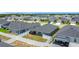 Aerial view of a home with a screened-in lanai, fenced yard, and solar panels in a Gathering-friendly neighborhood at 2005 Noble Dr, Davenport, FL 33837