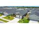Aerial view of a single-story home featuring a two-car garage and well-maintained landscaping at 2005 Noble Dr, Davenport, FL 33837