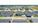 Aerial shot of a new home with a screened-in patio and fenced backyard in a vibrant, growing neighborhood at 2005 Noble Dr, Davenport, FL 33837