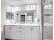 Bathroom featuring a glass door shower and a dual sink vanity with counterspace at 2005 Noble Dr, Davenport, FL 33837