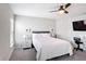 Bright bedroom features a ceiling fan, carpet, and stylish furnishings at 2005 Noble Dr, Davenport, FL 33837