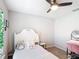 Bedroom featuring a bed, window, ceiling fan, a vanity and chair, and gray carpeting at 2005 Noble Dr, Davenport, FL 33837