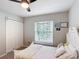Bedroom featuring a bed, window, ceiling fan, and gray carpeting at 2005 Noble Dr, Davenport, FL 33837