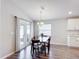 Elegant dining room featuring a stylish chandelier, dining table, and access to the patio at 2005 Noble Dr, Davenport, FL 33837