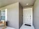 Welcoming front porch with a clean, modern entrance and decorative 'welcome' mat at 2005 Noble Dr, Davenport, FL 33837