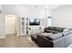 Spacious living room with a large sectional sofa, media center, and bright, neutral walls at 2005 Noble Dr, Davenport, FL 33837