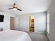 Spacious primary bedroom showcasing connecting bathroom entrance and ceiling fan at 2005 Noble Dr, Davenport, FL 33837