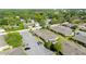 This aerial shot shows a community with mature landscaping, parking and manicured lawns at 206 Diamond Cv # 106, Casselberry, FL 32707