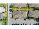 An aerial view shows the buildings, roads, parking, and landscaping of the community at 206 Diamond Cv # 106, Casselberry, FL 32707