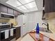This kitchen features stainless steel appliances, dark wood cabinetry and a refrigerator at 206 Diamond Cv # 106, Casselberry, FL 32707