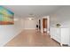 Bright living space featuring tile floors, neutral decor, and a view into the kitchen at 206 Diamond Cv # 106, Casselberry, FL 32707