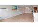 Spacious living area with tile flooring, neutral walls, and abundant natural light at 206 Diamond Cv # 106, Casselberry, FL 32707
