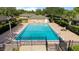 Community pool, fenced with lounge chairs on the patio at 206 Diamond Cv # 106, Casselberry, FL 32707