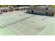 Community tennis courts, fenced in with nearby clubhouse at 206 Diamond Cv # 106, Casselberry, FL 32707