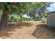 Beautiful backyard with mature shade trees creating a serene outdoor space and offering room to relax at 2106 Altoona Ln, Deltona, FL 32738