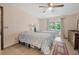 Well-lit bedroom with two beds, dresser, and sliding glass door to the outdoors at 2106 Altoona Ln, Deltona, FL 32738