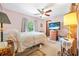 Bedroom with ceiling fan, TV, and window bringing in the natural light at 2106 Altoona Ln, Deltona, FL 32738