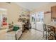 Bonus room featuring a desk, sitting area, and access to the kitchen at 2106 Altoona Ln, Deltona, FL 32738
