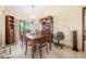 Spacious dining room featuring a large wooden table and access to a patio at 2106 Altoona Ln, Deltona, FL 32738