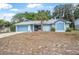 Charming single-story home featuring a well-maintained yard, palm tree, and an attached garage at 2106 Altoona Ln, Deltona, FL 32738