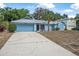 Charming single-story home featuring a well-maintained yard, palm tree, and an attached garage at 2106 Altoona Ln, Deltona, FL 32738