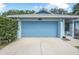 Well-maintained garage featuring an attached one-story home and mature landscaping at 2106 Altoona Ln, Deltona, FL 32738