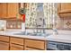 Close-up of kitchen sink with stainless steel fixtures and decorative backsplash at 2106 Altoona Ln, Deltona, FL 32738
