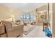 Bright living room features tile floors, comfortable seating, and great natural light at 2106 Altoona Ln, Deltona, FL 32738