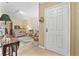 Cozy living room with tile floors, a comfortable sofa, and abundant natural light at 2106 Altoona Ln, Deltona, FL 32738