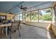 Screened patio area for dining and relaxation, showcasing backyard view at 2106 Altoona Ln, Deltona, FL 32738