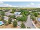 An aerial view shows homes surrounded by trees with a long lake to the side at 2116 Truffle Ln, Casselberry, FL 32707