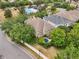 Aerial shot showcases the property's pool, community amenities, and lush surroundings at 2116 Truffle Ln, Casselberry, FL 32707