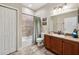 Bathroom featuring a vanity with sink, tiled bathtub with shower, and neutral color scheme at 2116 Truffle Ln, Casselberry, FL 32707