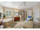 Elegant bathroom features a soaking tub, walk-in shower, double vanity, and a relaxing chaise lounge at 2116 Truffle Ln, Casselberry, FL 32707