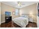 Cozy bedroom featuring a comfortable bed, bedside tables, and modern ceiling fan at 2116 Truffle Ln, Casselberry, FL 32707