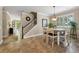 Eat-in dining space featuring tile flooring, staircase, and natural light from multiple windows at 2116 Truffle Ln, Casselberry, FL 32707