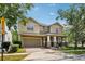 Charming two-story home with a well-manicured lawn and a two-car garage at 2116 Truffle Ln, Casselberry, FL 32707