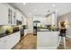 Spacious kitchen with stainless-steel appliances, white cabinetry, and tile floors at 2116 Truffle Ln, Casselberry, FL 32707
